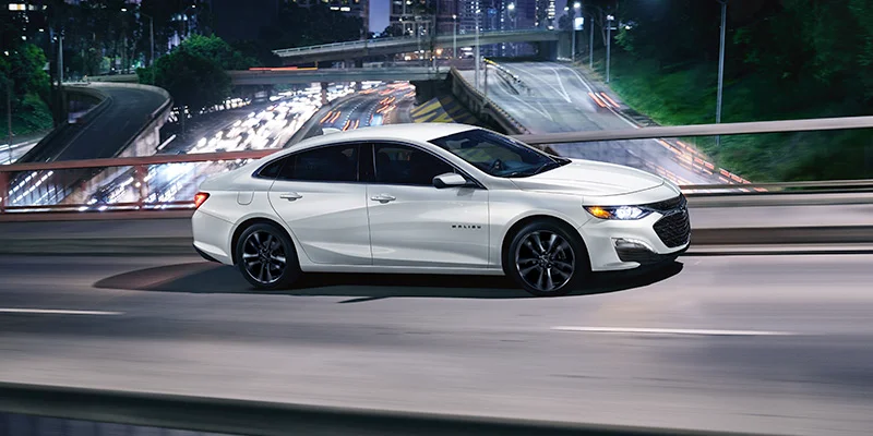 A 2025 Chevrolet Malibu driving on a highway near Fort Gratiot Township, MI