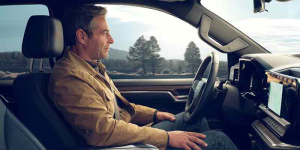 A man sitting in his 2025 Chevrolet Sierra 1500 near Fort Gratiot, MI